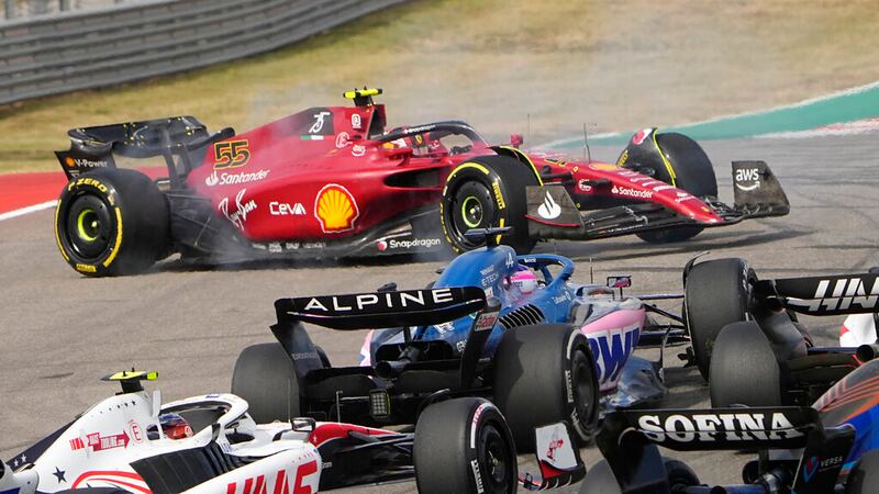 Ferrari driver Carlos Sainz, of Spain, spins in Turn 1 during the first lap of the Formula One...
