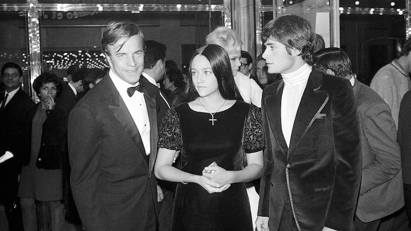 FILE - "Romeo and Juliet" movie director Franco Zeffirelli, left, actors Olivia Hussey,...