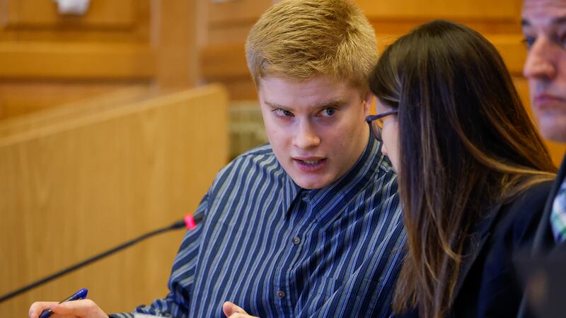 Jeremy Goodale (left) talks with his defense co-counsel Nicole Jensen during his sentence...