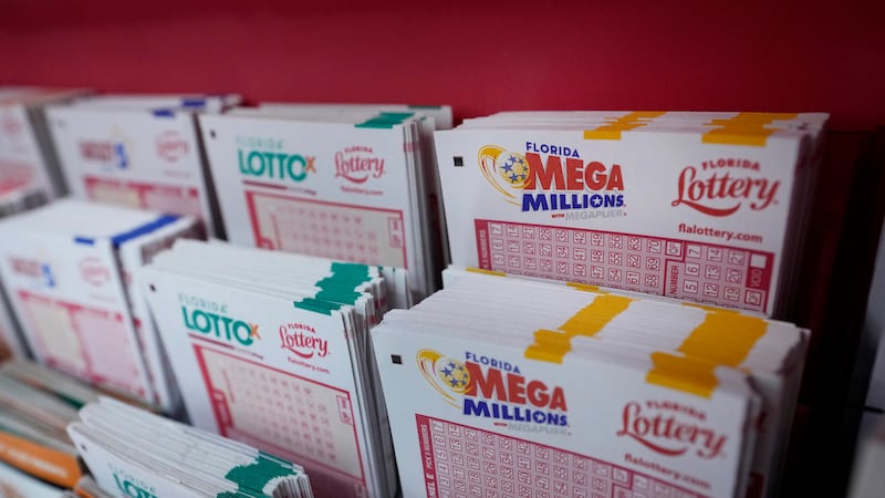 FILE - Lottery forms are seen, Aug. 7, 2023, at the Presidente Supermarket in the Little...