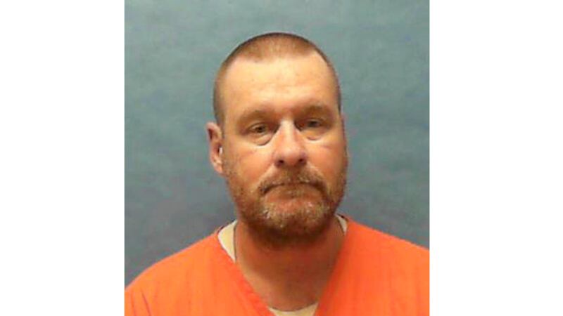 FILE - This booking photo provided by the Florida Department of Corrections shows Michael...